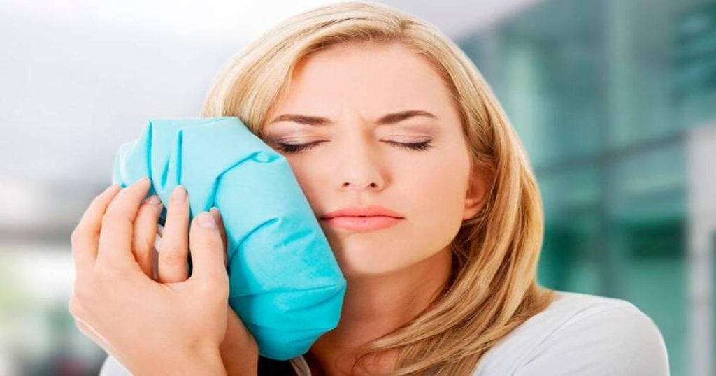 The woman finds a toothache relief tips